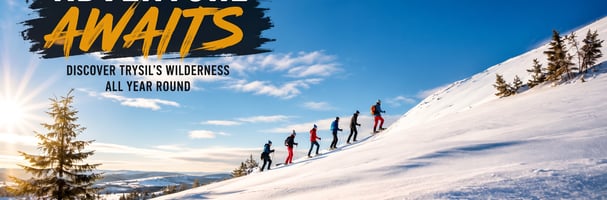 Guide med gruppe på fem personer på truger en solskinnsdag i fjellet