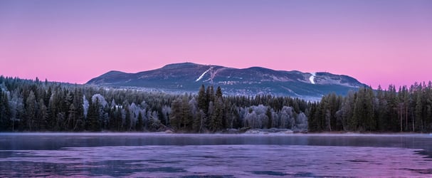Landskapsbilde av Trysilfjellet og Trysilelva
