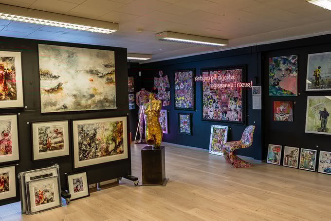 Colourful pictures on the wall inside Galleri Vågal